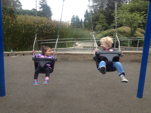 Sam and Evora in the swings