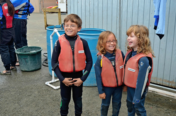 Cousins preparing for a kayaking trip