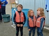 Cousins preparing for a kayaking trip