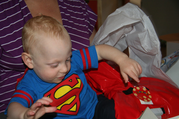 Sam the Anti-Preemie: Opening Judy\'s great gift (cute rain coat!)