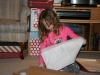 Irene unwrapping her Santa gift