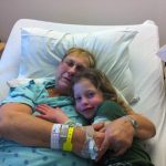 Tutu and Irene cuddling in the hospital